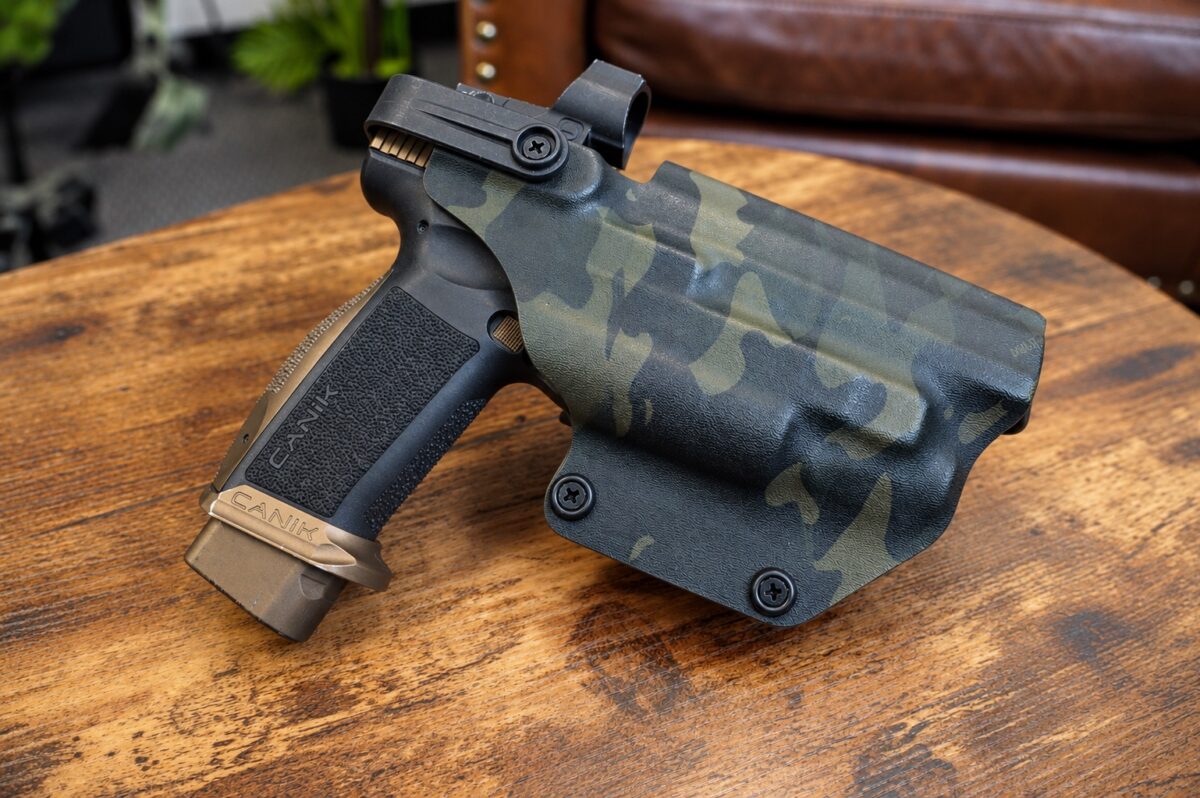 Level II retention OWB holster in MultiCam Black kydex molded for a Canik pistol with weapon light