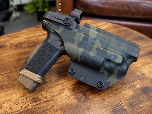 Level II retention OWB holster in MultiCam Black kydex molded for a Canik pistol with weapon light